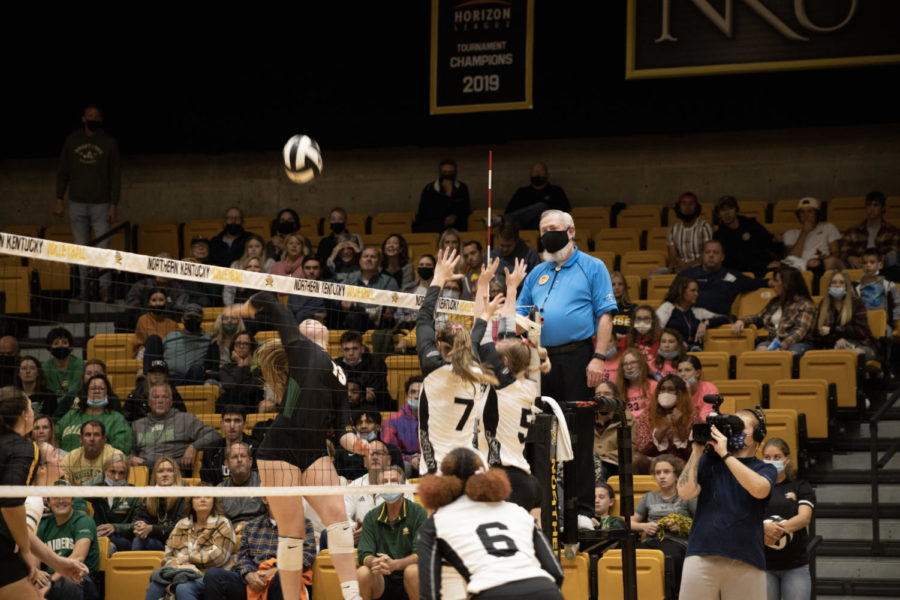 A Wright State player prepares to spike the ball as two NKU players rise up to block the attempt on Friday.