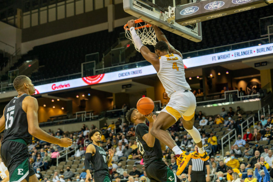 NKU forward Adrian Nelson (4) slams a dunk down during the win over Eastern Michigan. Nelson recorded 16 points.