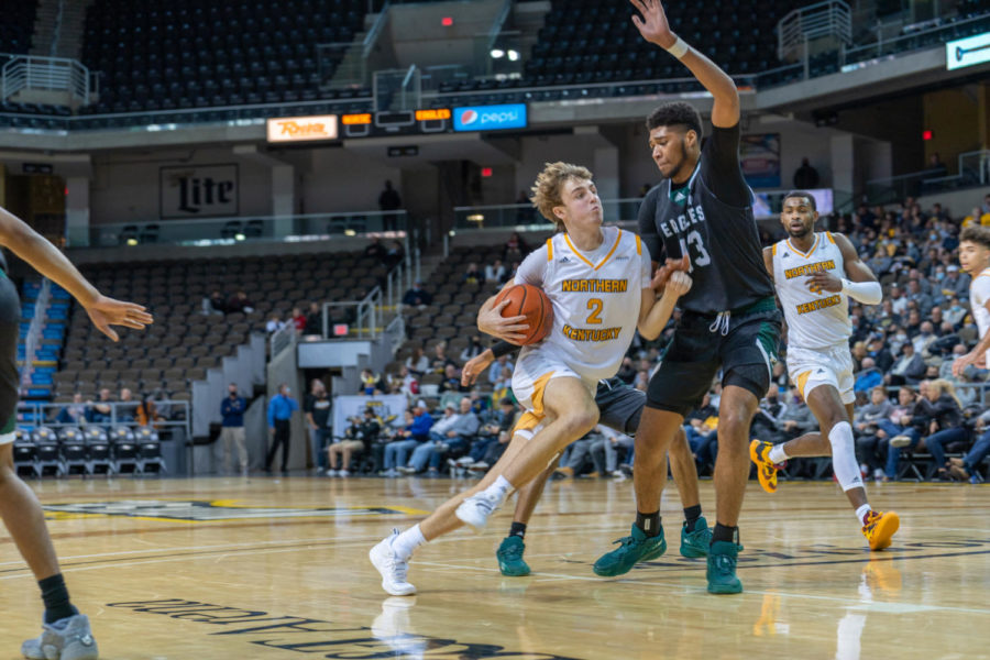NKU guard Sam Vinson (2) drives past an Eastern Michigan defender on Thursday. Vinson led the Norse with 17 points.