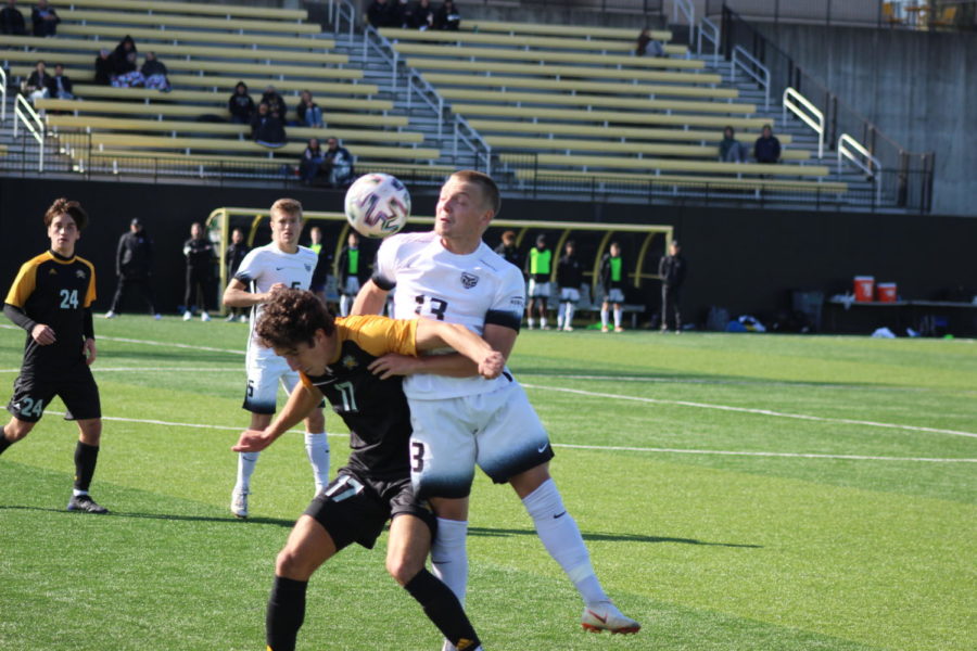 NKU's Sam Robinson (17) battles with an Oakland player for the ball on Wednesday.