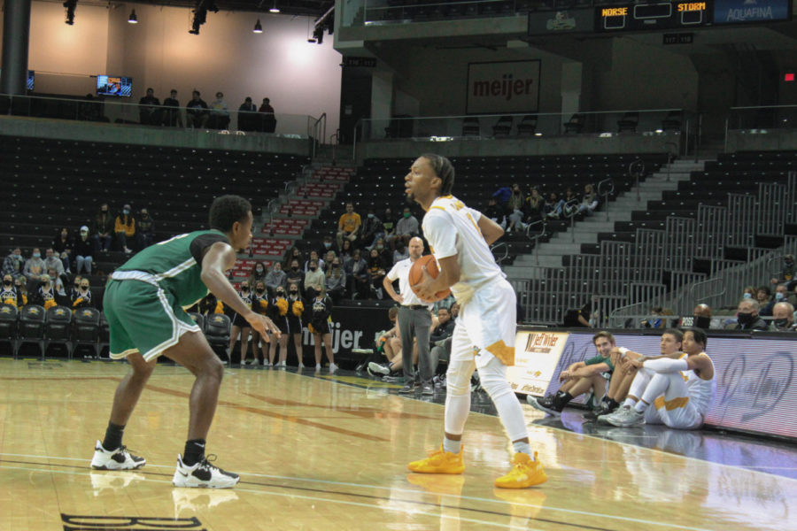 NKU guard Bryson Langdon (11) surveys the court during NKUs exhibition win over Lake Erie College on Thursday night. 