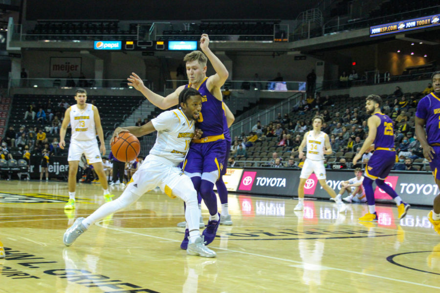 NKU guard Bryson Langdon (11) drives past a Western Illinois defender on Monday.