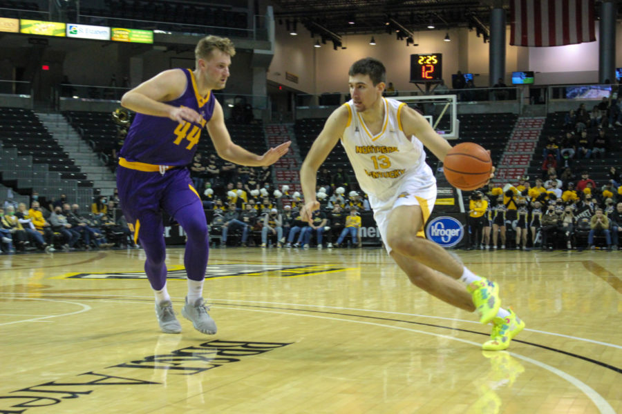 NKU forward David Böhm (13) drives toward the hoop during the loss against Western Illinois on Monday.