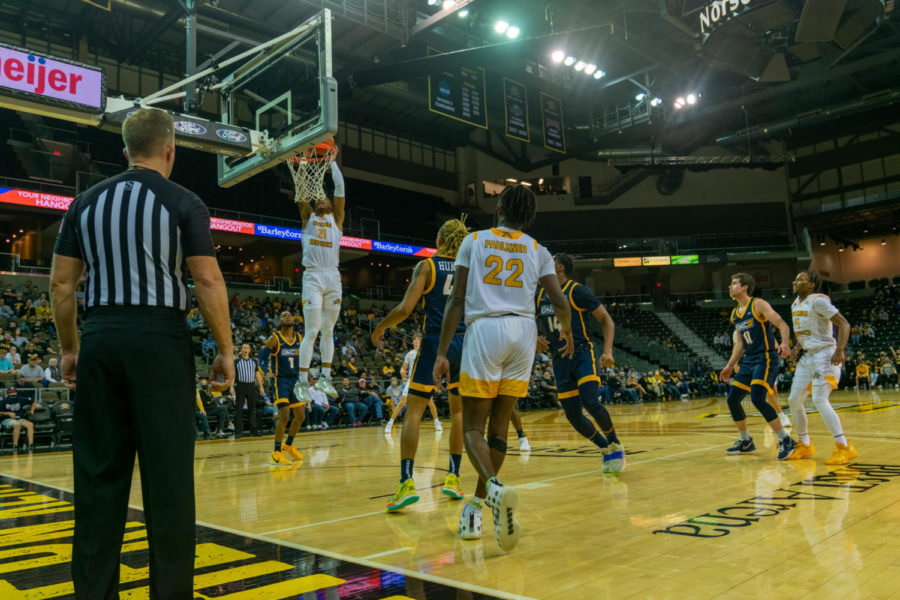 NKU forward Chris Brandon finishes off a dunk against UNC Greensboro. Brandon had four points and five rebounds on Friday.