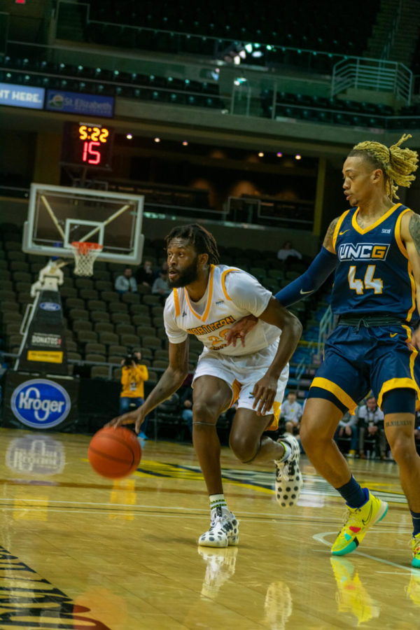 NKU guard Trevon Faulkner dribbles against UNC Greensboro on Friday. Faulkner reached 1,000 career points during the game.