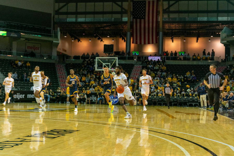 NKU guard Trevon Faulkner drives on a fast break against UNC Greensboro on Friday.