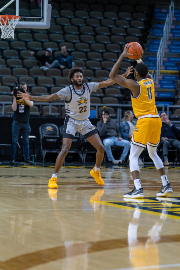 NKU guard Trevon Faulkner (22) defends a Canisius player on the perimeter on Wednesday night.