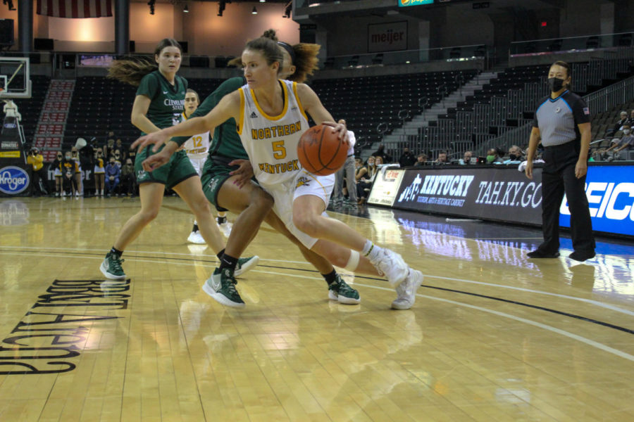NKU guard Lindsey Duvall (5) drives past a Cleveland State defender on Friday night. The Norse fell to the Vikings 63-52.