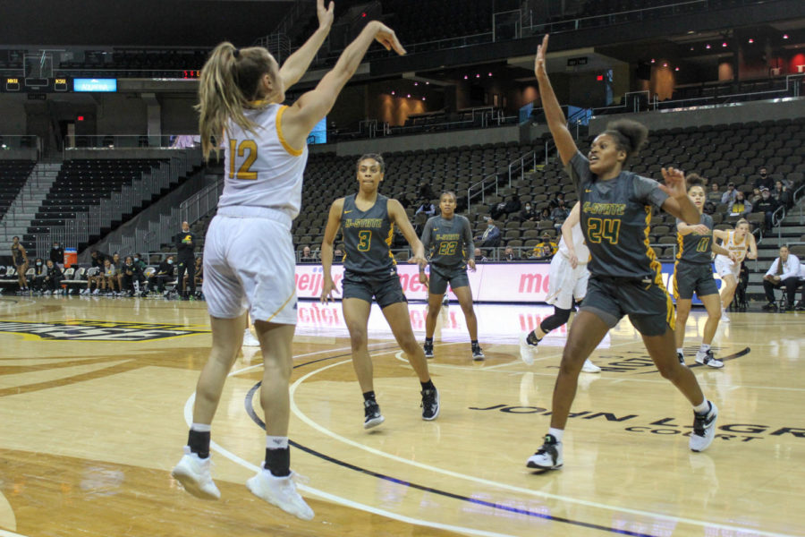 NKU guard Carissa Garcia (12) takes a three against Kentucky State. Garcia posted a season-high 17 points on Wednesday.