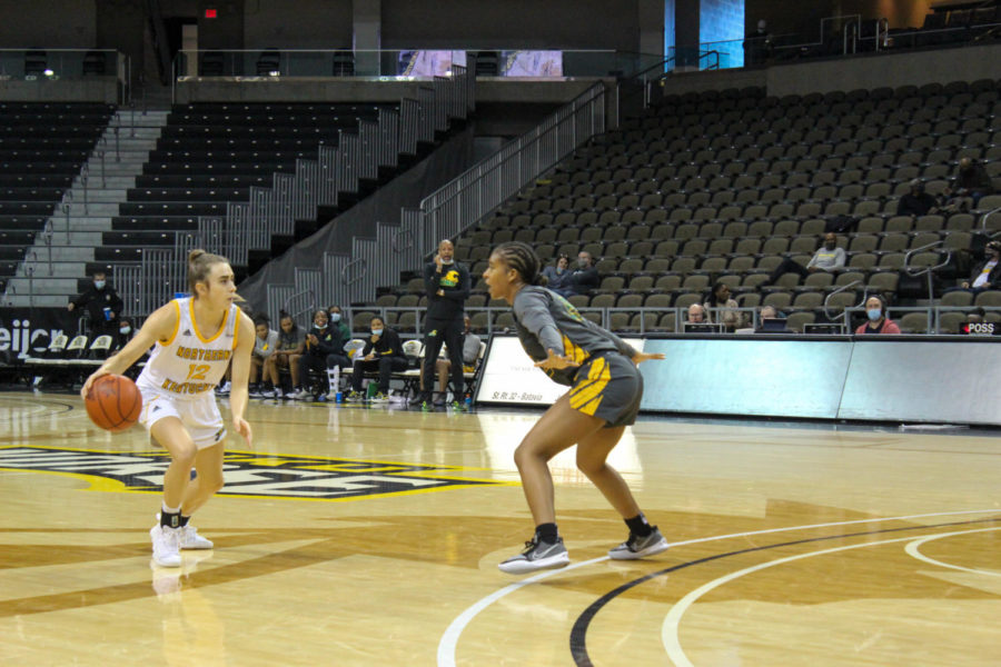 NKU guard Carissa Garcia (12) dribbles at the top of the key against Kentucky State on Wednesday.