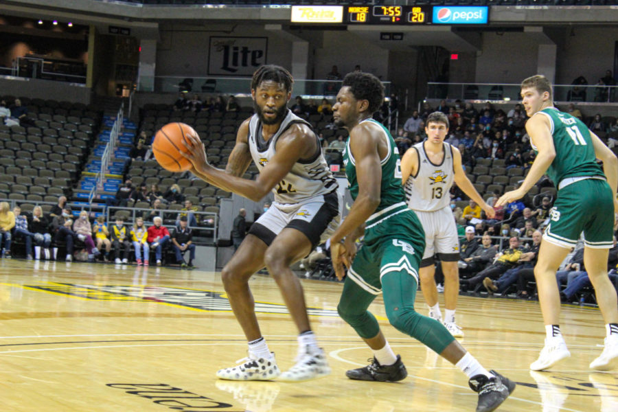NKU guard Trevon Faulkner (22) posts up on a defender on Thursday. Faulkner was second on the Norse with 19 points in the victory.