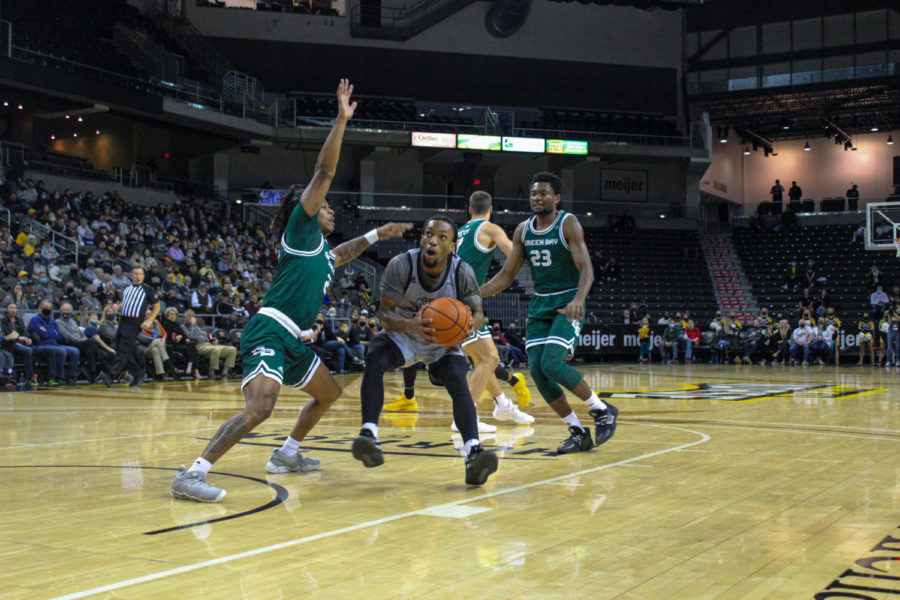 NKU guard Bryson Langdon (11) drives into the lane against Green Bay. Langdon finished with seven points and three assists on Thursday.