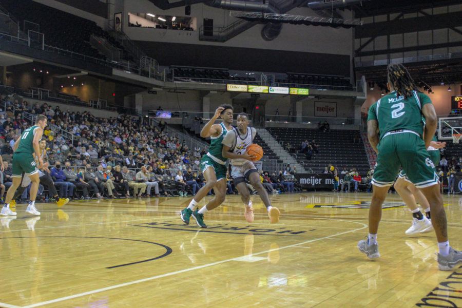 NKU guard Marques Warrick (3) drives into the lane against Green Bay on Thursday. Warrick scored 20 points in the win.