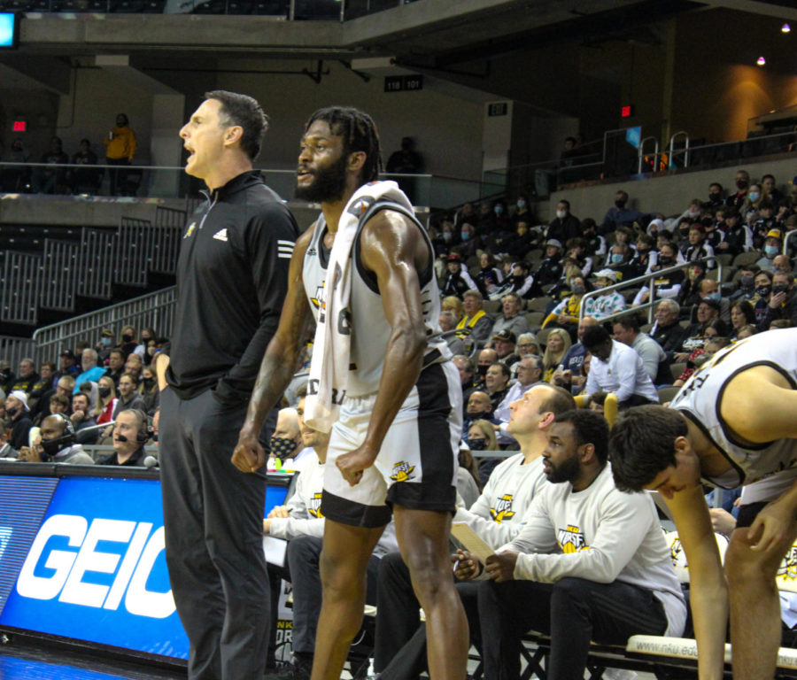 NKU guard Trevon Faulkner celebrates on the bench during the Norse 79-74 win over Green Bay on Thursday. Faulkner scored 19 points in the victory.