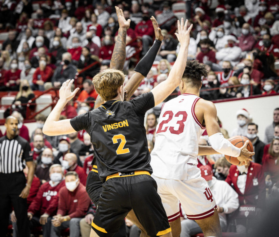 Two Norse defenders defend Indiana forward Trayce Jackson-Davis on Wednesday.