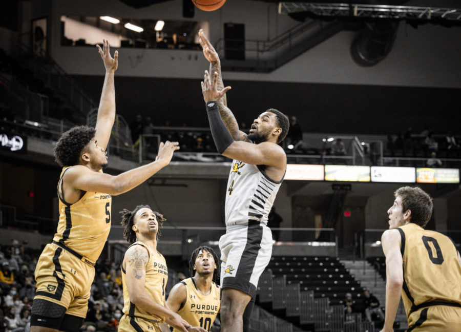 NKU forward Adrian Nelson (4) takes a shot against Purdue Fort Wayne on Friday at BB&T Arena.
