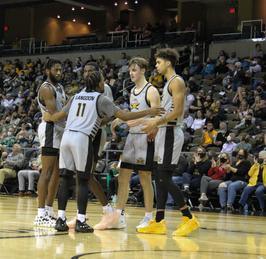 NKU mens basketball players huddle on Thursday night against Green Bay at BB&T Arena.