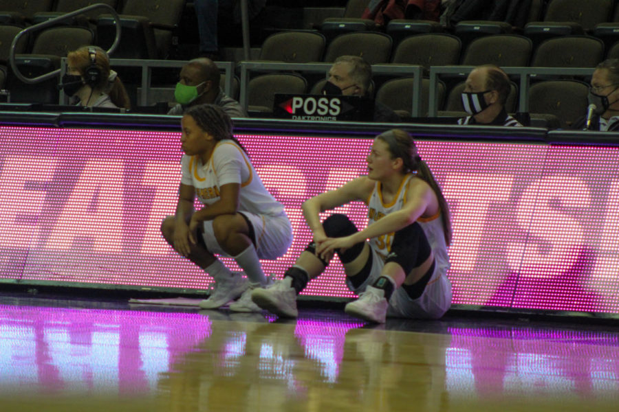 Kailee Davis and Emmy Souder wait to check in against Wright State. The Norse defeated the Raiders 77-59.