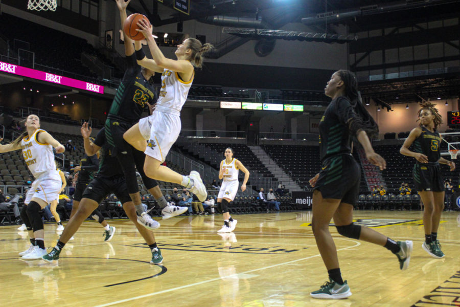 NKU guard Lindsey Duvall soars into the air for a layup against Wright State. Duvall recorded a double-double with 17 points and 13 rebounds.