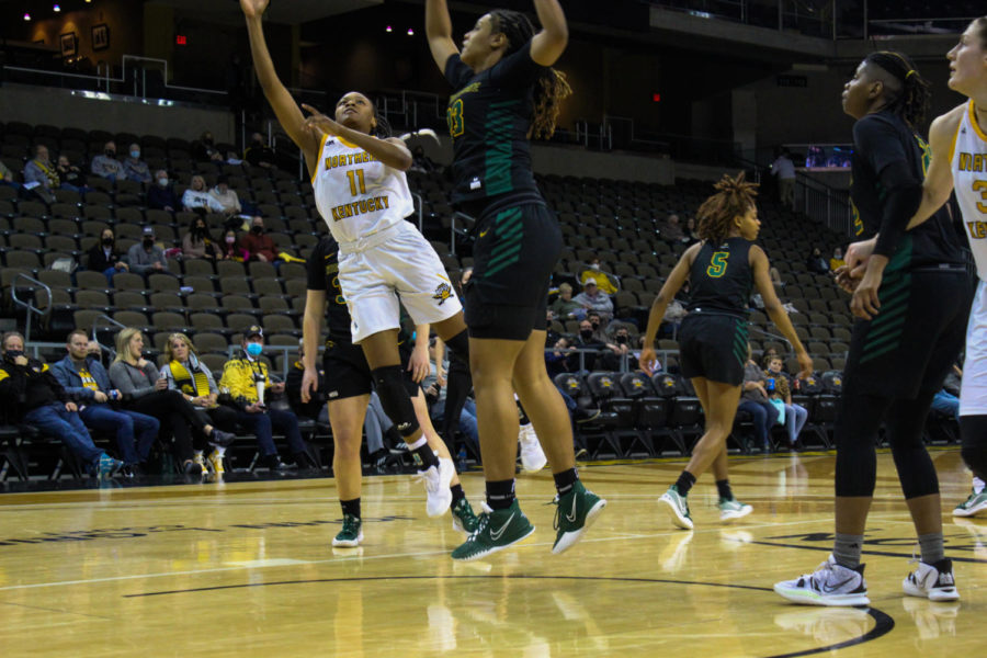 NKU guard Khamari Mitchell-Steen (11) shoots a layup against Wright State on Thursday. 