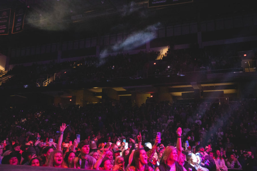 Fans at BB&T Arena scream and cheer as Cody Johnson and Easton Corbin perform during their concert on Friday.