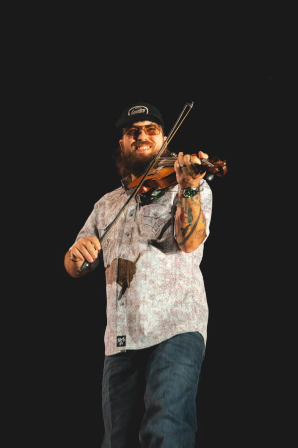 A violinist performs during the Cody Johnson concert at BB&T Arena on Friday night.
