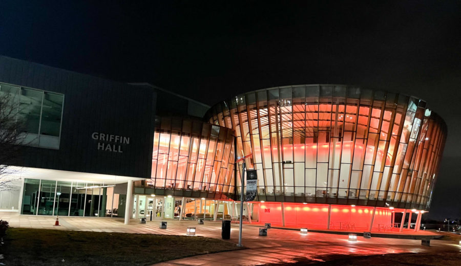 The outside of Griffin Hall lit up orange in honor of the Cincinnati Bengals playing in the Super Bowl on Sunday.
