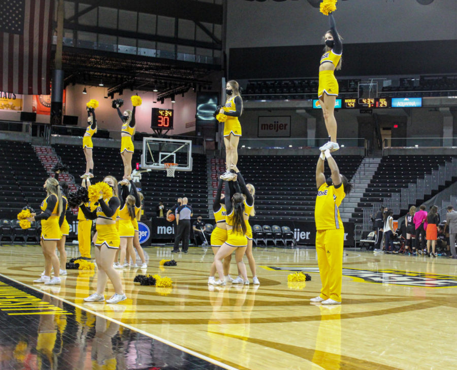 The NKU cheerleading team performs at BB&T Arena on Thursday during a break in the womens basketball game against UIC. 