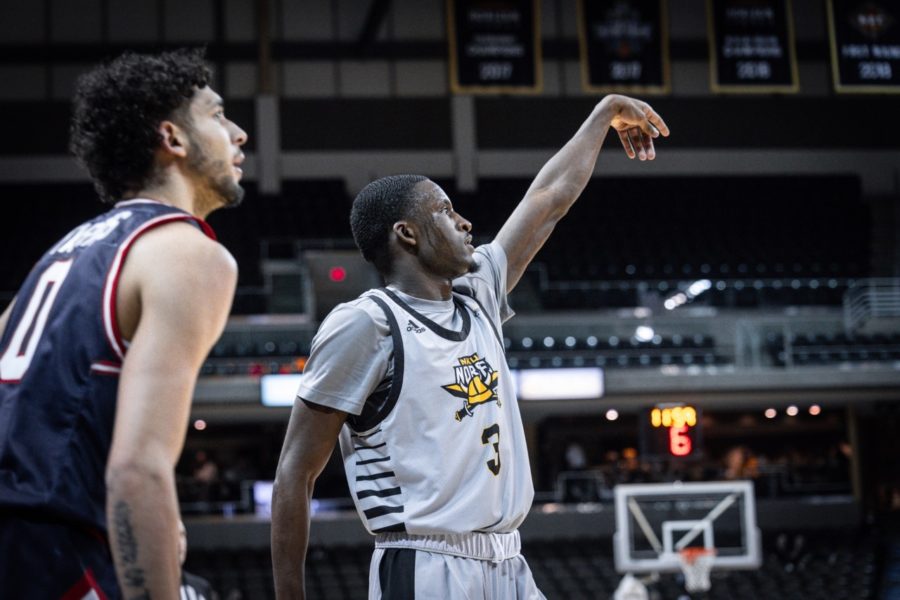 NKU+guard+Marques+Warrick+%283%29+follows+through+after+a+shot+against+Robert+Morris.