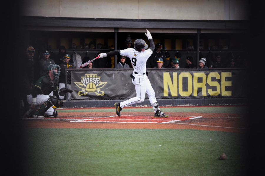 NKU infielder Liam McFadden-Ackman follows through on a swing against Wright State.