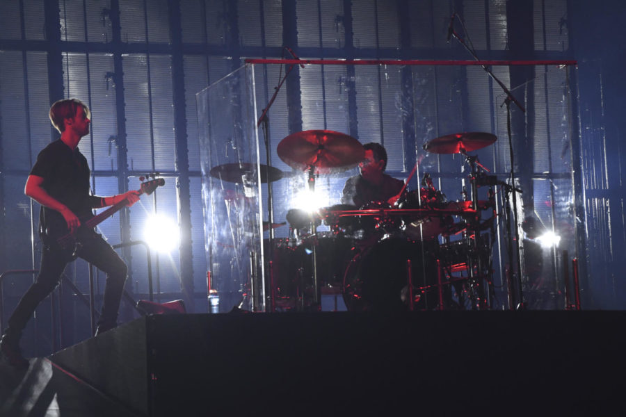 Eilishs brother, Finneas OConnell and drummer Andrew Marshall on stage.
