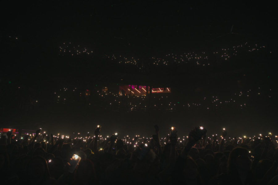 Fans hold their lights up for opener, Bulow, as she sings a cover of Frank Ocean's, "Lost."
