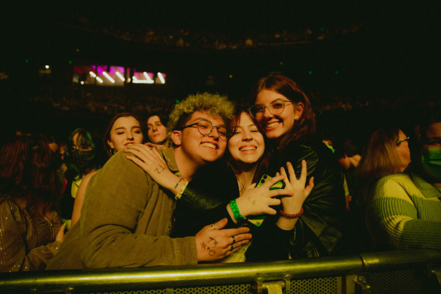 Fans of Conan hugging each other before the show.