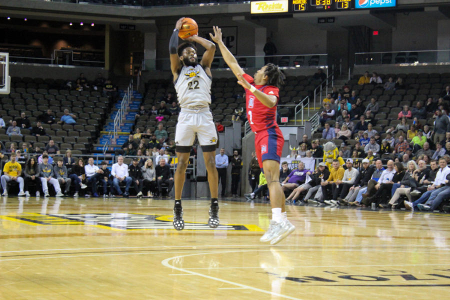 NKU guard Trevon Faulkner (22) takes a jump shot against Detroit Mercy on Thursday.