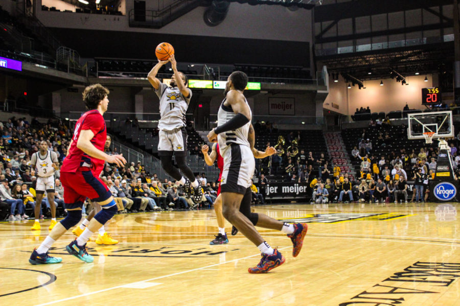 NKU guard Bryson Langdon (11) takes a shot in the paint against Detroit Mercy in the Horizon League Tournament quarterfinals on Thursday.