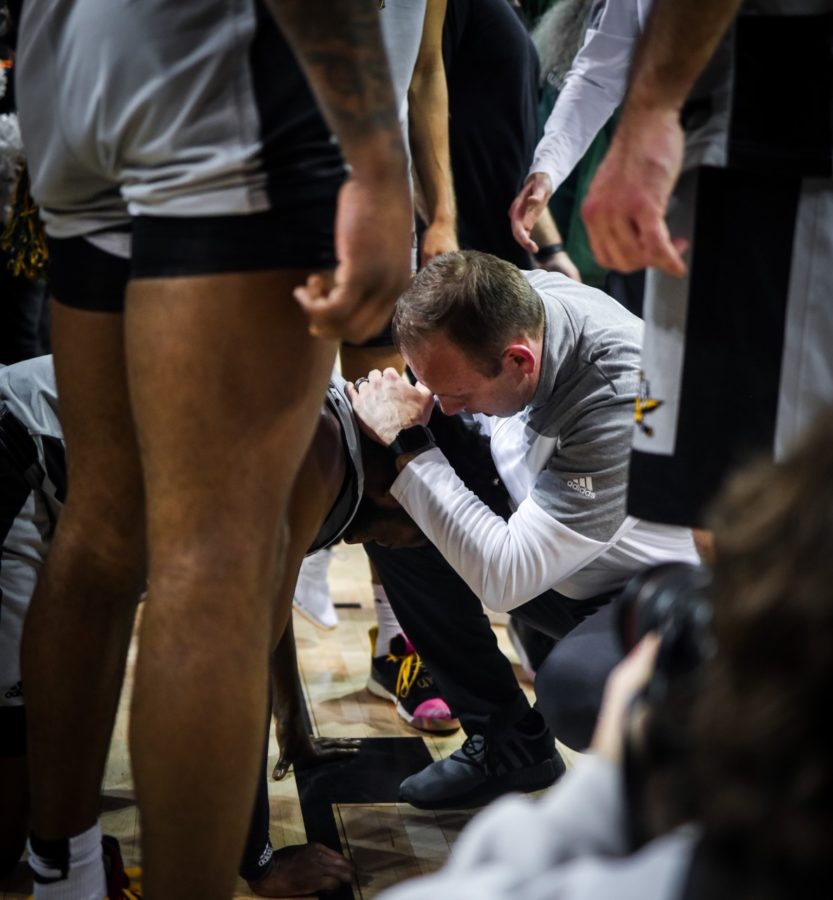 NKU assistant coach Eric Haut consoles Trevon Faulkner following NKUs loss to Wright State in the Horizon League Tournament championship.