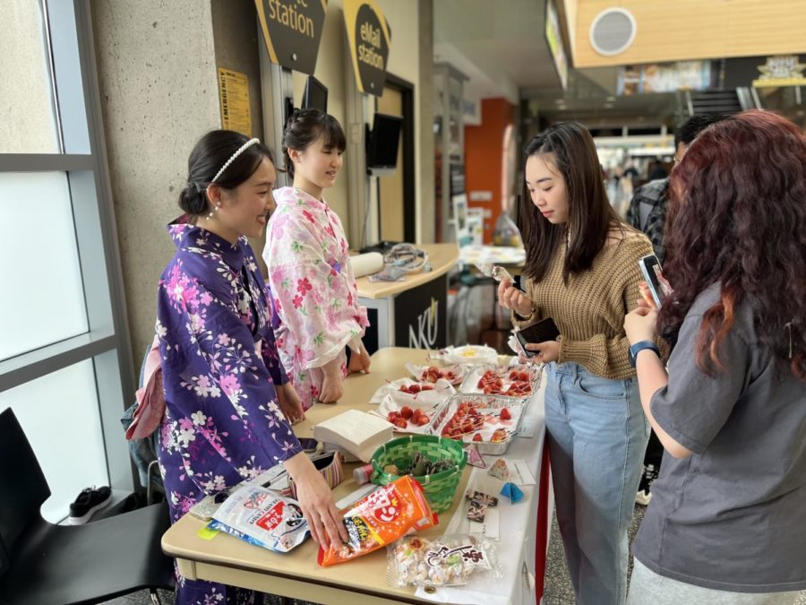 Students trying different Japanese foods in the Student Union. 
