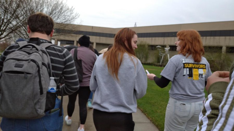 Students marching around Loch Norse at the end of Take Back the Night.