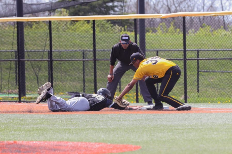 NKU first baseman Ryan Glass makes a tag on a pickoff attempt against Purdue Fort Wayne.