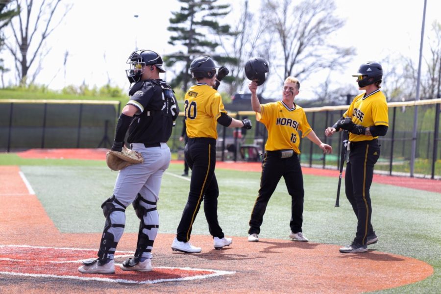 Zack Minton celebrates his three-run home run in the second inning against Purdue Fort Wayne.