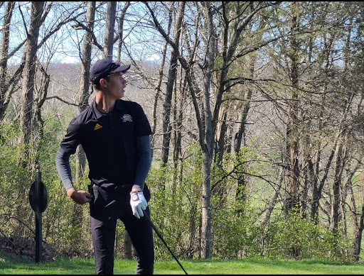 NKU freshman golfer Ryan Butler watches after driving the ball. 
