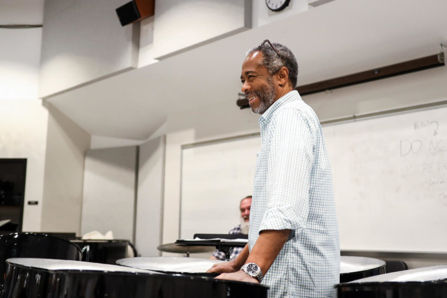 Student and teacher have a laugh during rehearsal in between run-throughs.