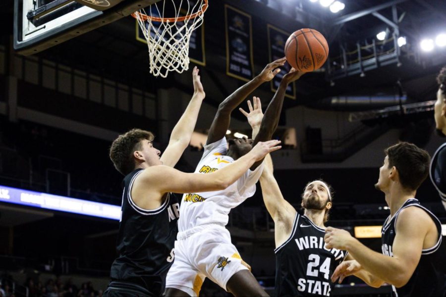 Marques Warrick makes an effort towards the basket while being surrounded by multiple Wright State defenders in the second half of Thursday nights game against Wright State. Warrick would lead the offensive charge for the Norse, scoring 19 points with nine of them coming from three-point shots.