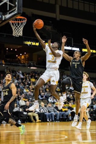 Marques Warrick drives to the basket for a layup with Oakland’s Keaton Hervey (1) tailing behind to attempt a block. Warrick played 34 minutes and led the scoring for the Norse with 16 points in NKU’s 64-63 loss.