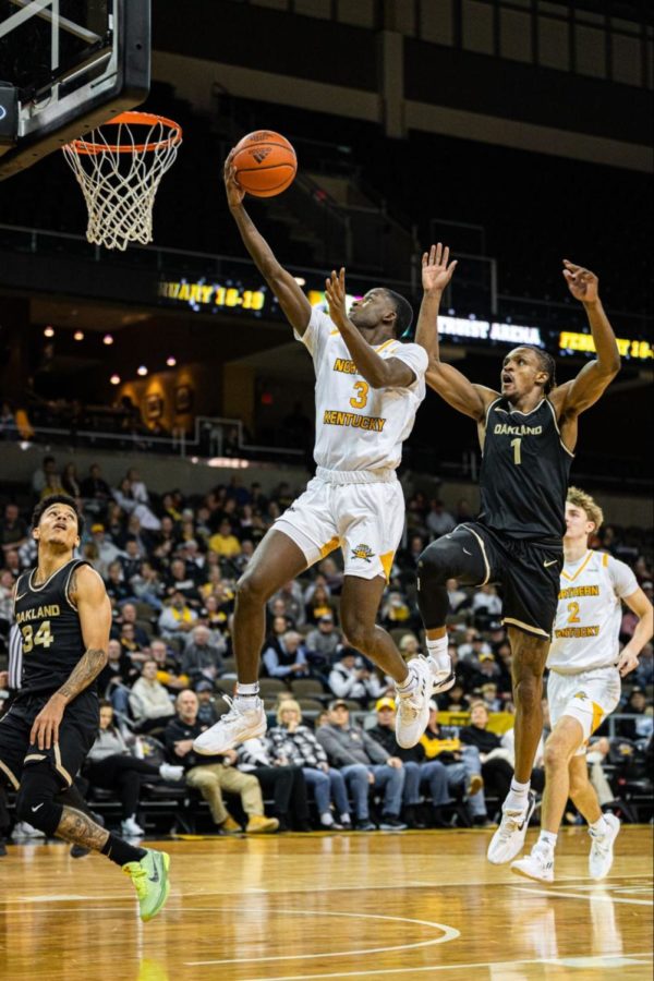 Marques Warrick drives to the basket for a layup with Oakland’s Keaton Hervey (1) tailing behind to attempt a block. Warrick played 34 minutes and led the scoring for the Norse with 16 points in NKU’s 64-63 loss.