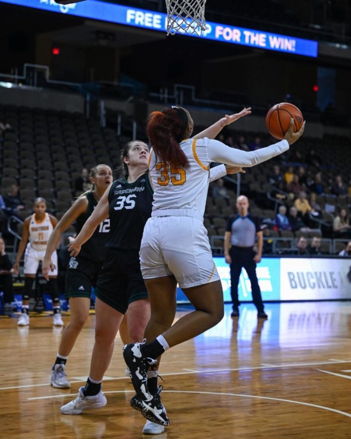 Trinity Thompson attempts a layup as she is fouled by Green Bay’s Julia Hartwig during the first half of NKU and Green Bay’s matchup Saturday. Thompson contributed 10 points, three rebounds and an assist off the bench in 17 minutes played during the loss.