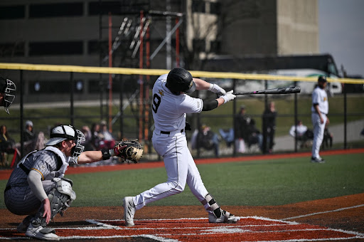 Liam McFadden-Ackman turns on a pitch for his second grand slam in the first inning of Sunday afternoon’s win for the Norse. The junior infielder went 5-for-6 with 10 runs batted in and hit for the cycle in the 27-4 rout of Western Michigan. 
