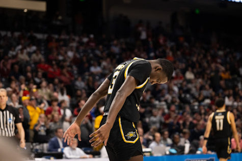 Marques Warrick takes a breather in between plays during NKU’s 63-52 loss to Houston Thursday night. Warrick was kept off the board in the first half but began to find his footing in the second, finishing with nine points and going 4-for-4 from the free throw line on the night.