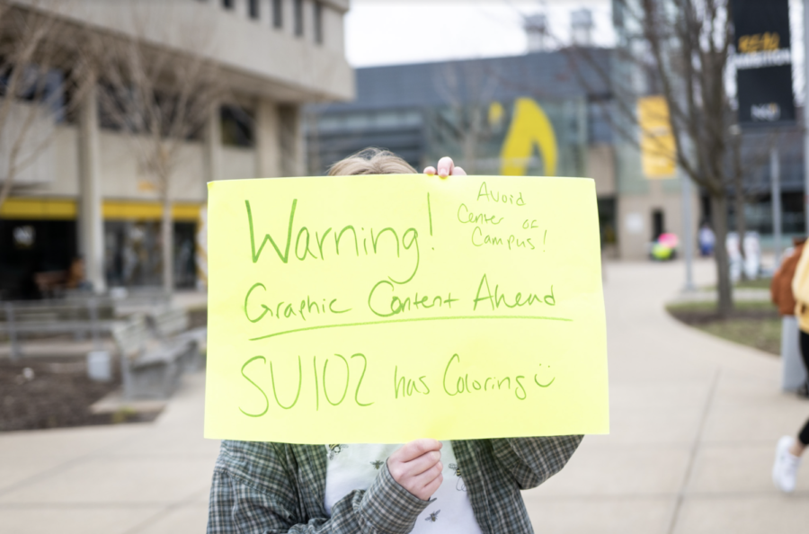 One of the few students around campus that warned students that were close to approaching the anti-abortion displays.