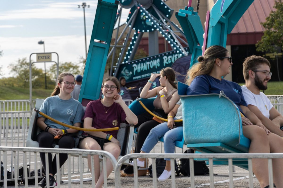 Smiles abounded on the swinging carousel ride.